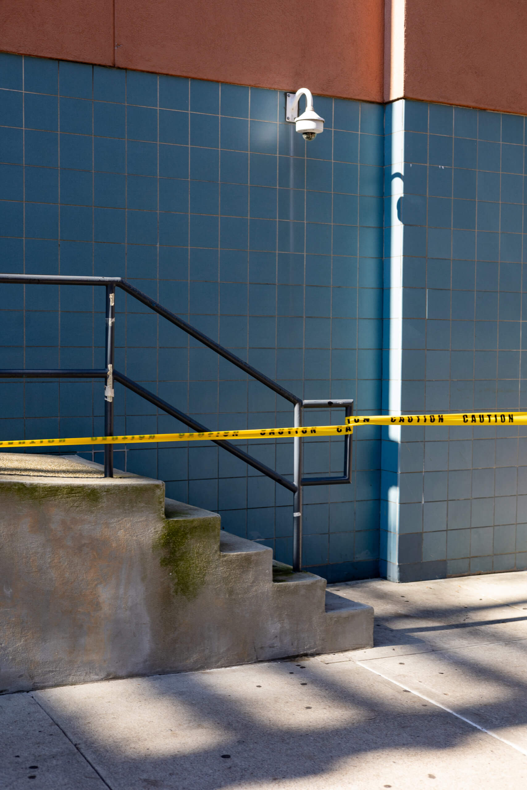 A photo of a construction site in New York, featuring a bold yellow "Caution" tape stretched across the scene, highlighting urban development and safety measures