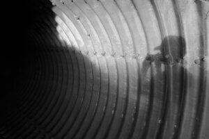 A self-portrait featuring the shadow silhouette of a person in a tunnel at a park in Dallas, Texas