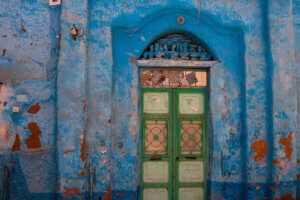 A beautifully painted Nubian house in Aswan, Egypt, with intricate blue artwork on its walls